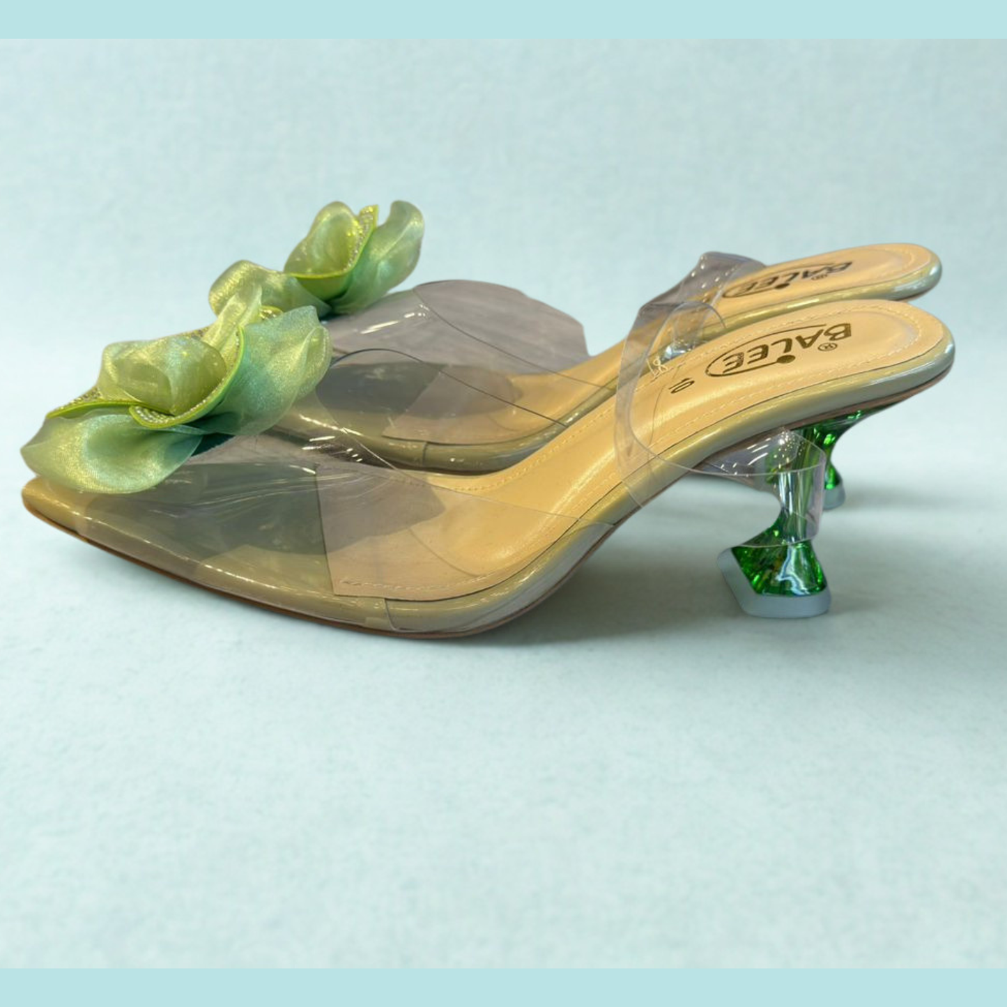 Transparent Heeled Sandals with Green Floral Embellishment – Elegant Women’s Party & Casual Footwear